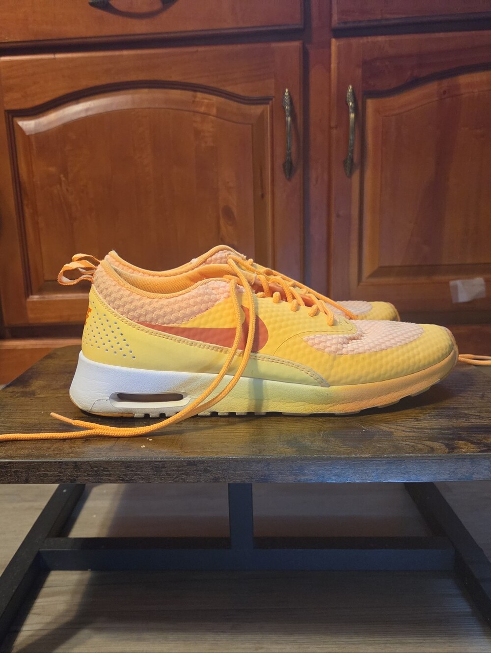 Nike Air Max Thea in a gradient orange/yellow ("Sunset" or "Laser)
